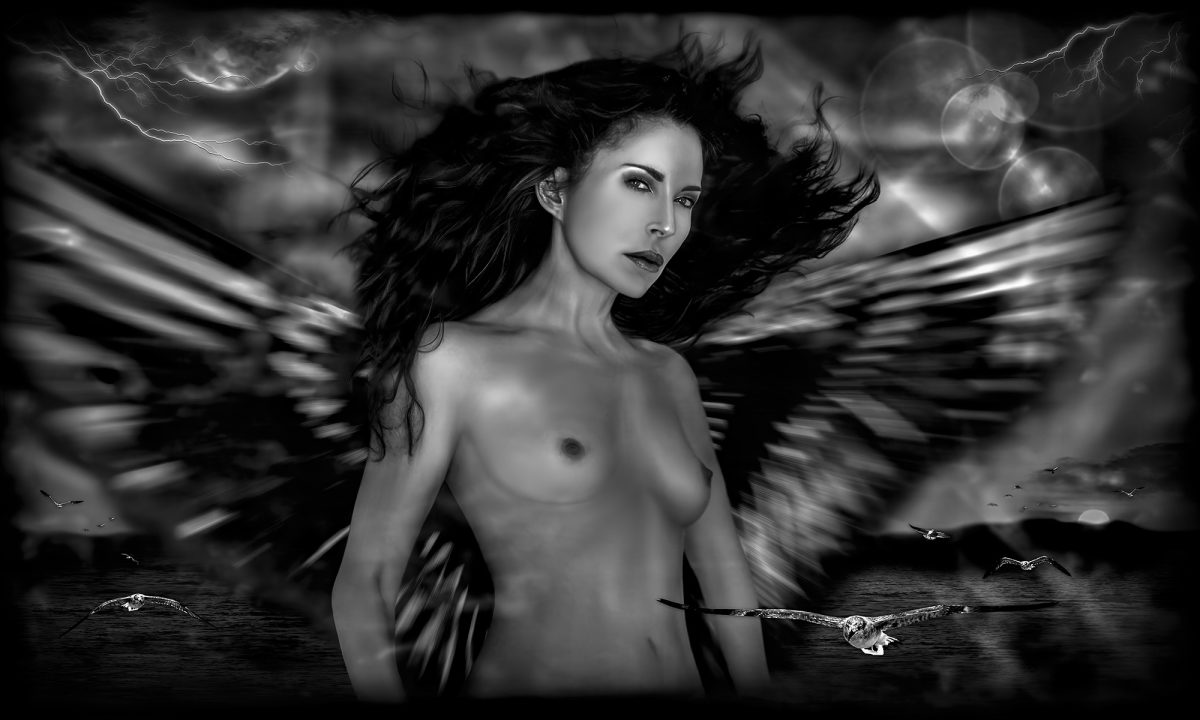 A black and white photo of a naked woman with wings.