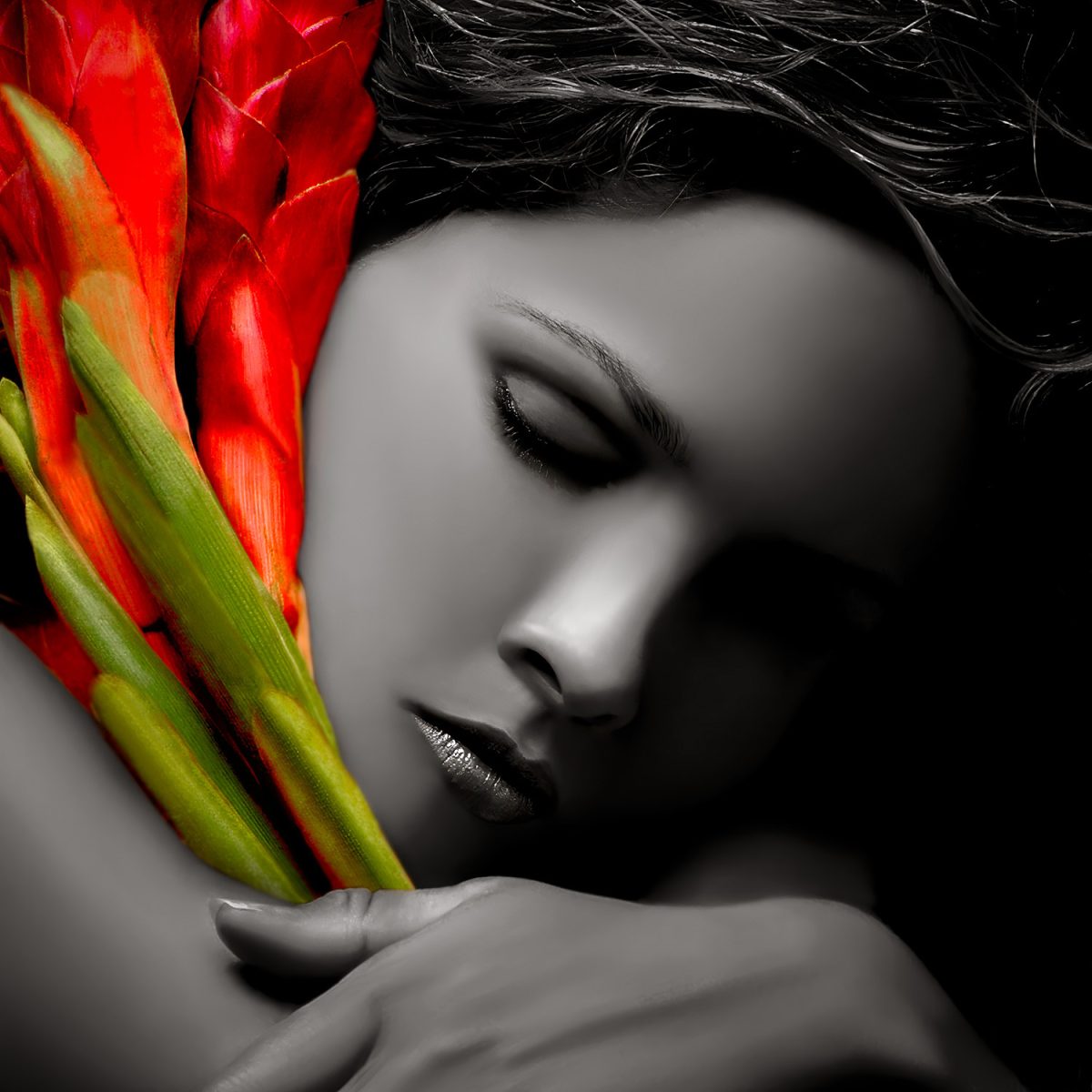 A woman is holding a bunch of flowers.