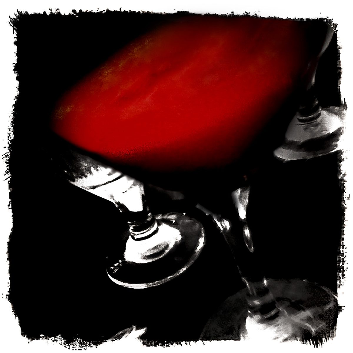 A red liquid in a martini glass.
