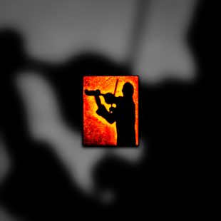 A silhouette of a man playing a violin.