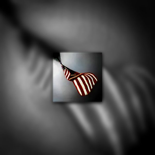 A color photo looking up a flagpole of an American flag.