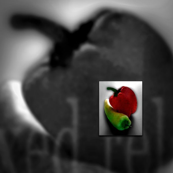 A color photo of a green pepper and a red pepper.