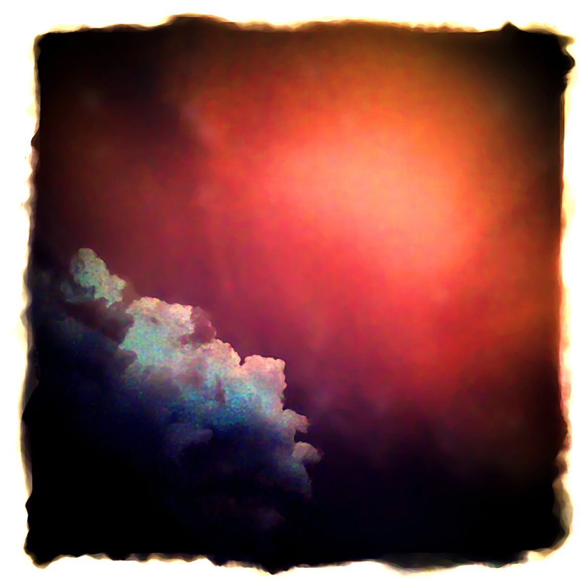 A photo of a red sky with clouds.