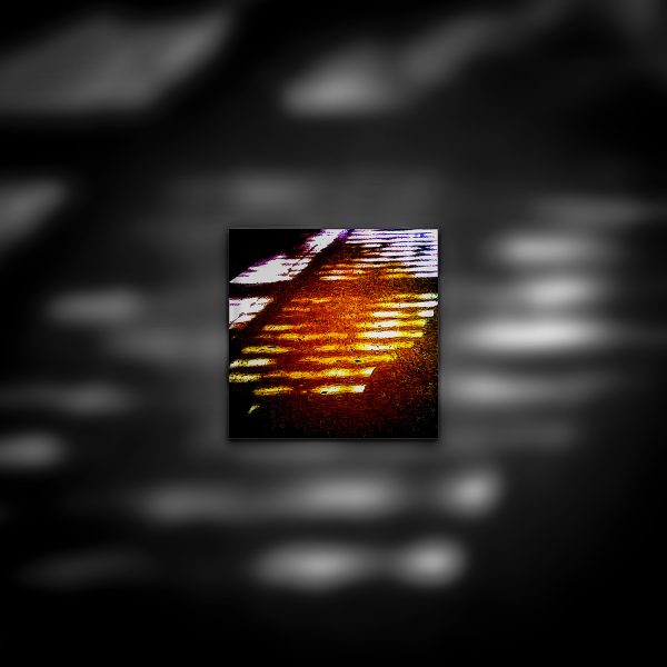 A color photo of a window with a light shining through it.