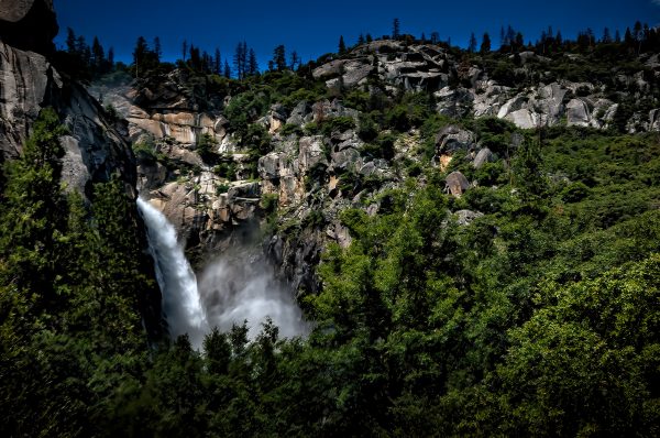 Mountain waterfall painting by Doug Heslep, Yosemite landscape art, nature-inspired fine art collection.