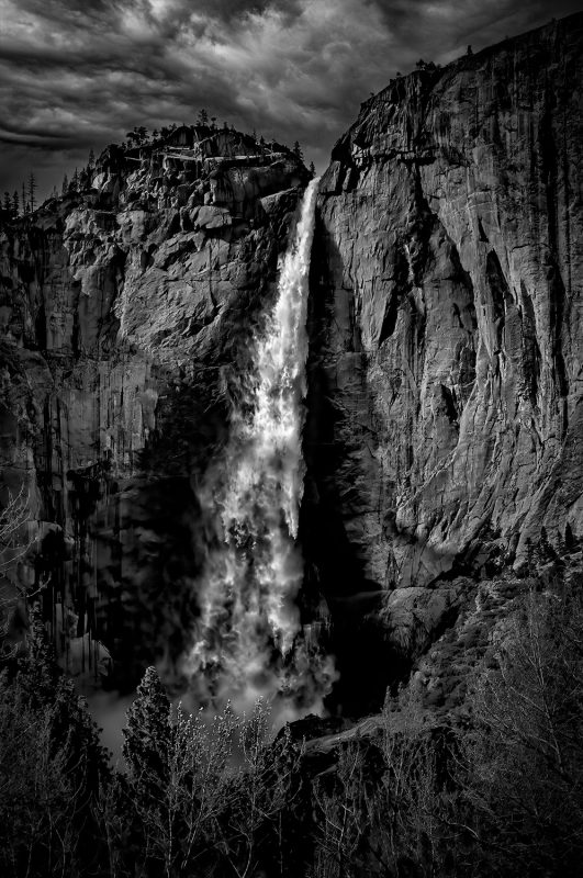 Waterfall in Yosemite National Park, black and white landscape photograph, Doug Heslep Fine Art collection, dramatic mountain scenery, nature artwork.
