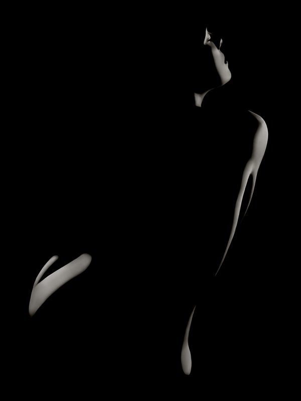 A silhouette of a woman in the dark.