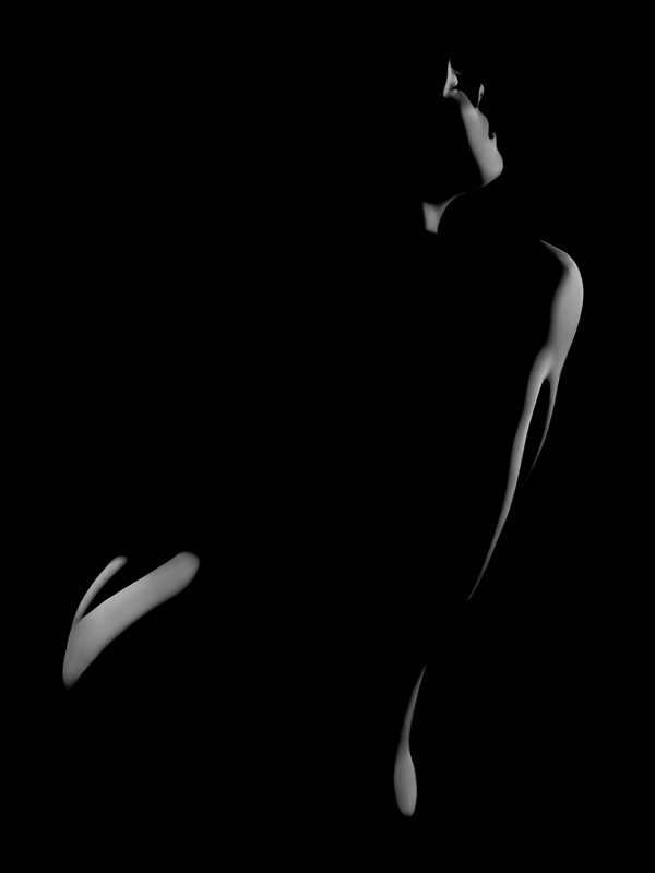 A silhouette of a woman in the dark.