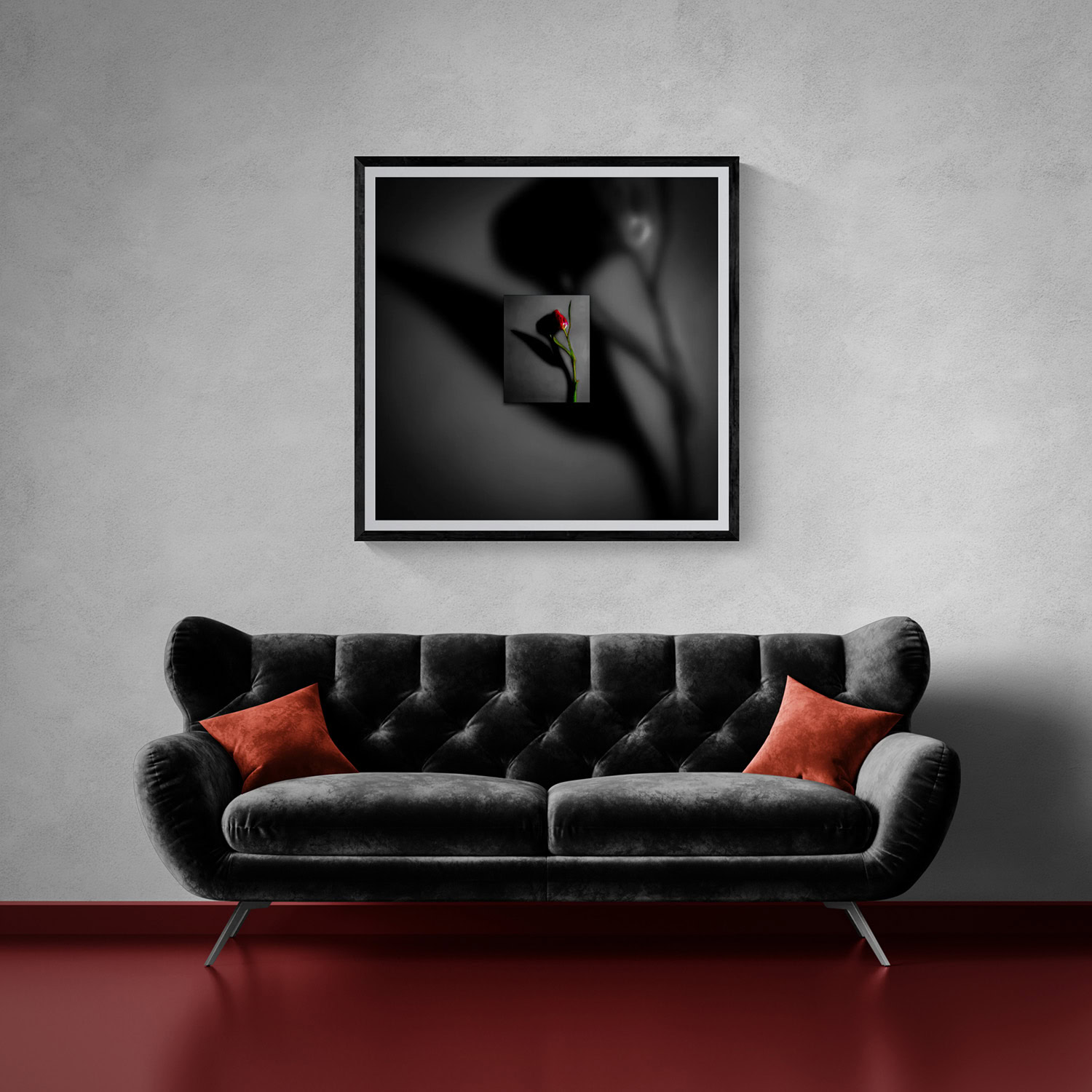 Black and white artwork with a red rose in a modern living room setting.