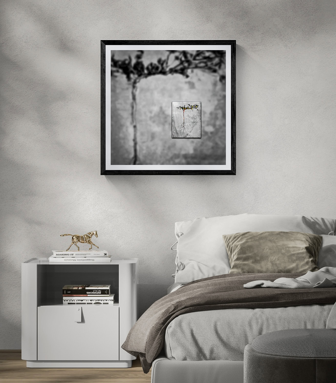 Modern black and white framed artwork hanging above a bed in a stylish bedroom.