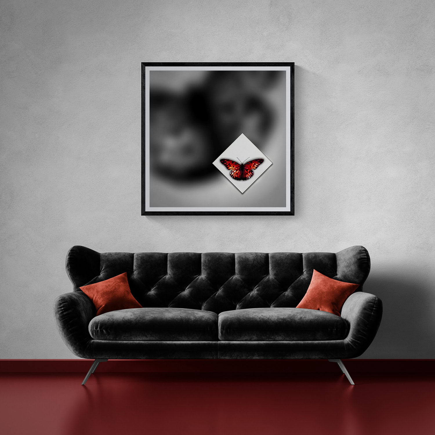 Modern art display with butterfly artwork and black sofa in gallery setting.