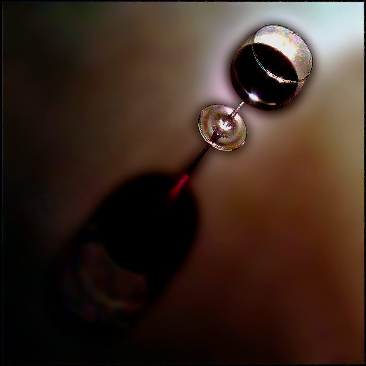 Midnight Cabernet by Doug Heslep, contemporary fine art still life featuring a tilted wine glass filled with deep red wine against an abstract, softly blurred background.