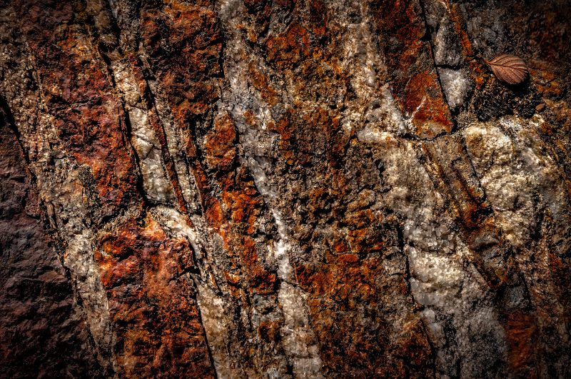 Vivid close-up of textured granite from The Doug Heslep Fine Art Collection.