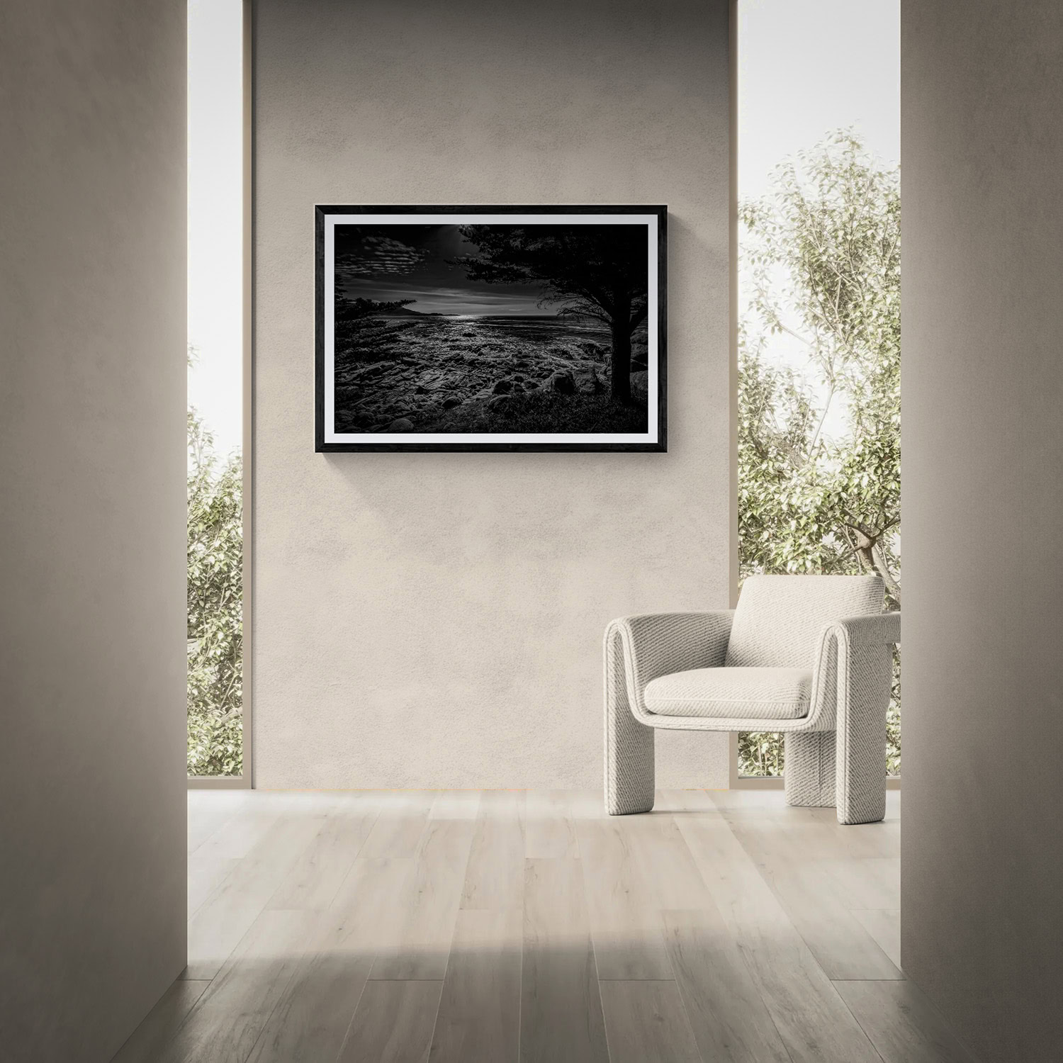 Black and white landscape photograph in a modern interior setting.