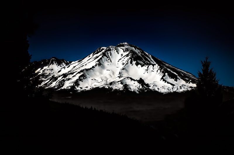 Snow-capped mountain landscape in the Doug Heslep Fine Art Collection.