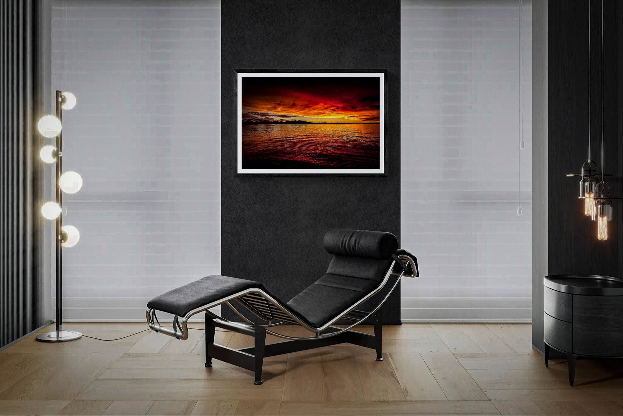 Contemporary room with sunset art piece and black lounge chair.