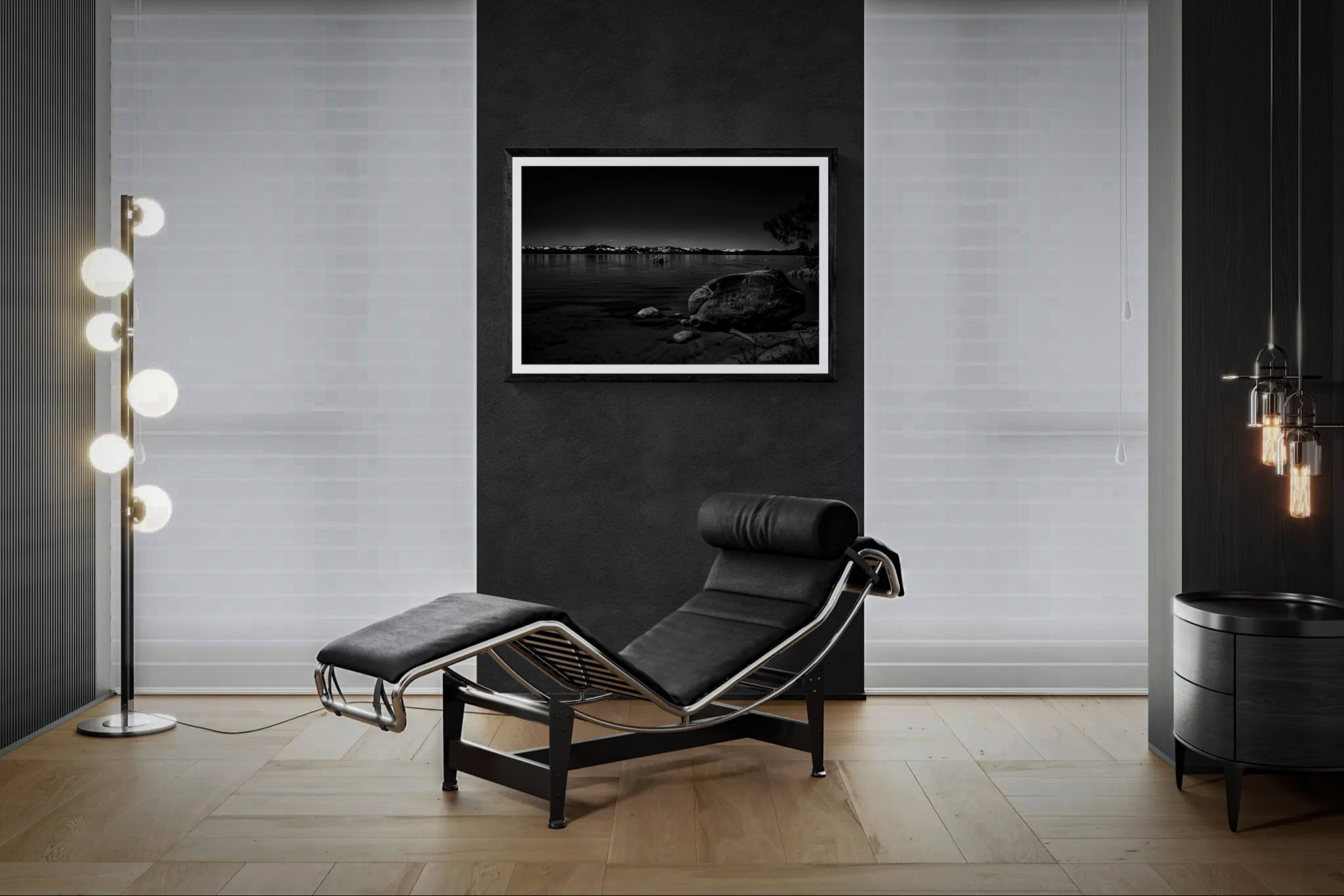 Contemporary room with black lounge chair and framed landscape art.