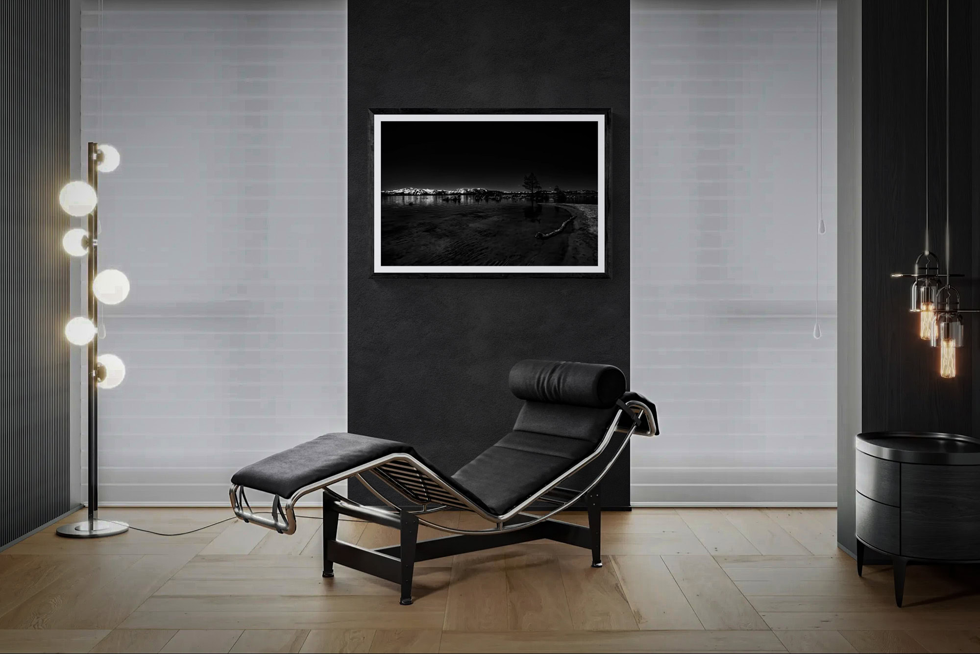 Contemporary living room with black lounge chair and framed artwork.