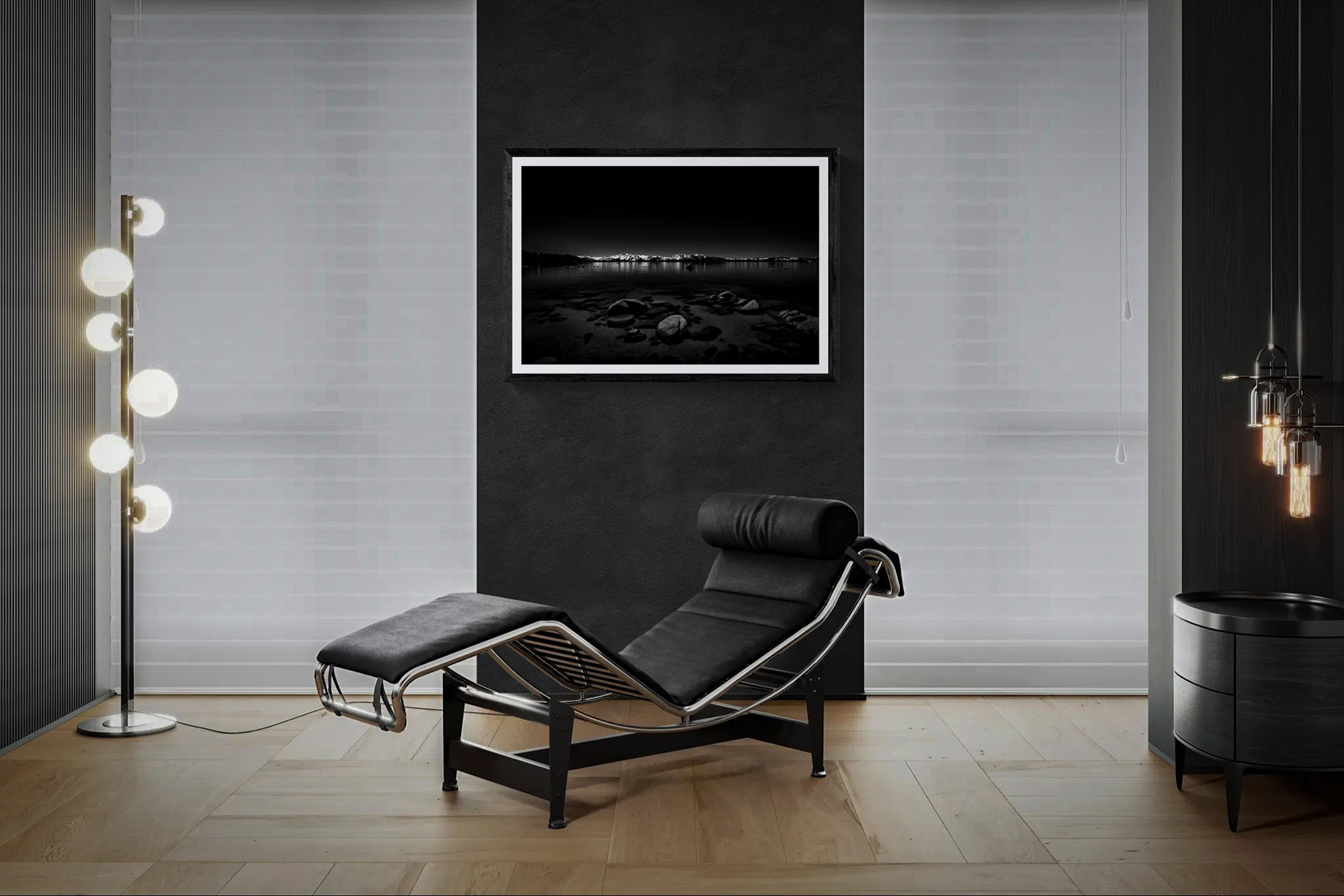 Contemporary living room with black lounge chair and framed artwork.