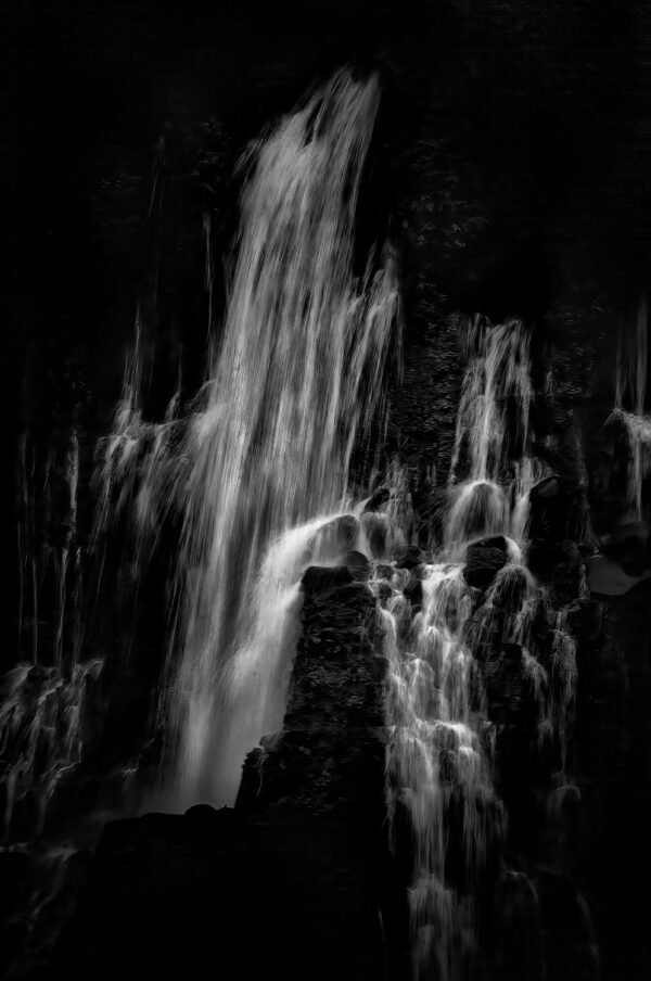 A black and white close up photograph of Burney Falls