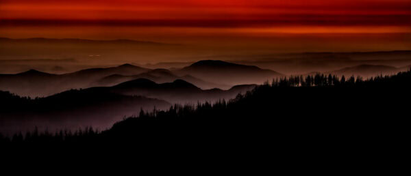 Colorful sunset while looking west across the mountain range after exiting King's Canyon