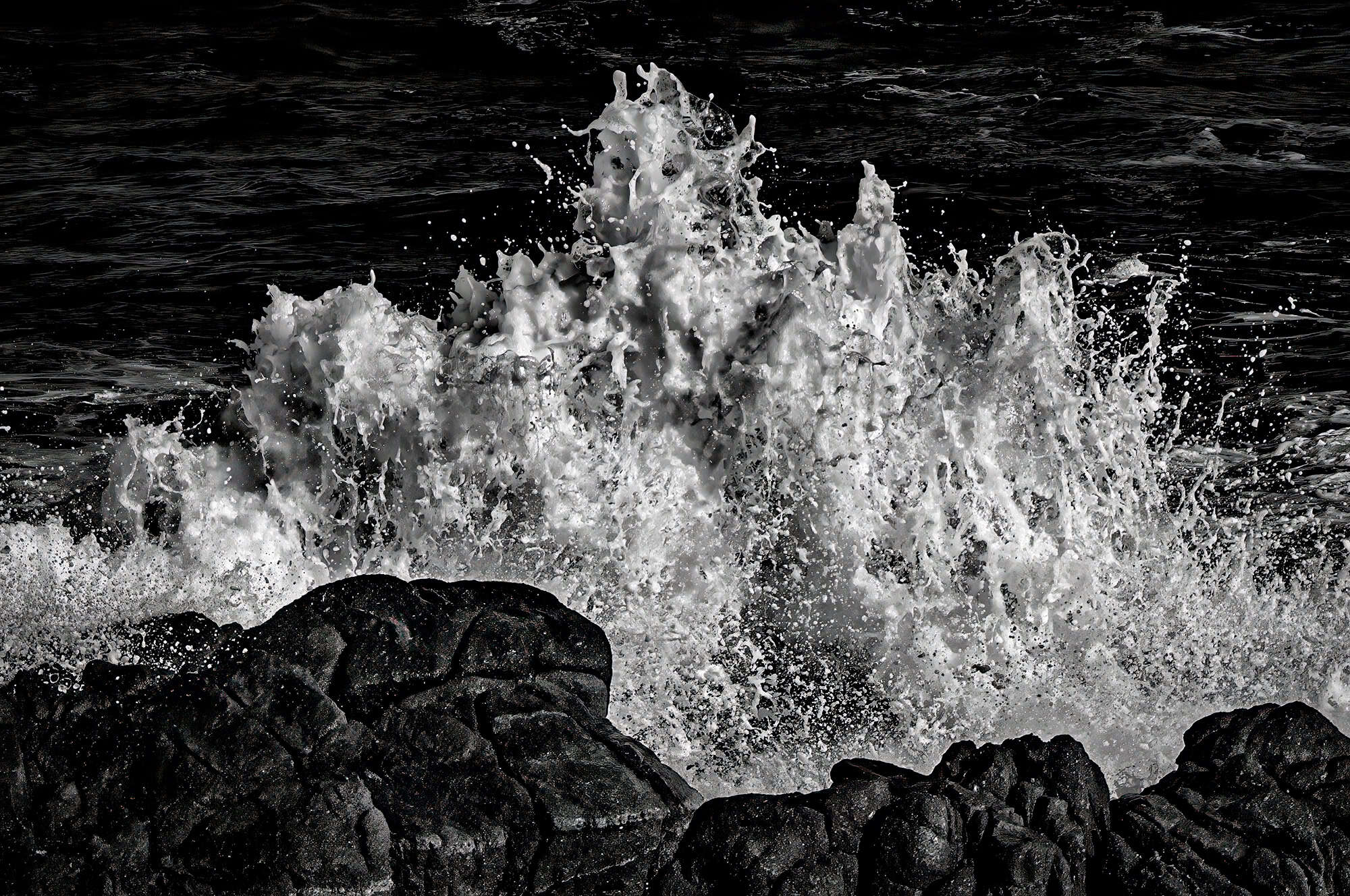 Waves splashing against rocks on the Pacific Grove coastline
