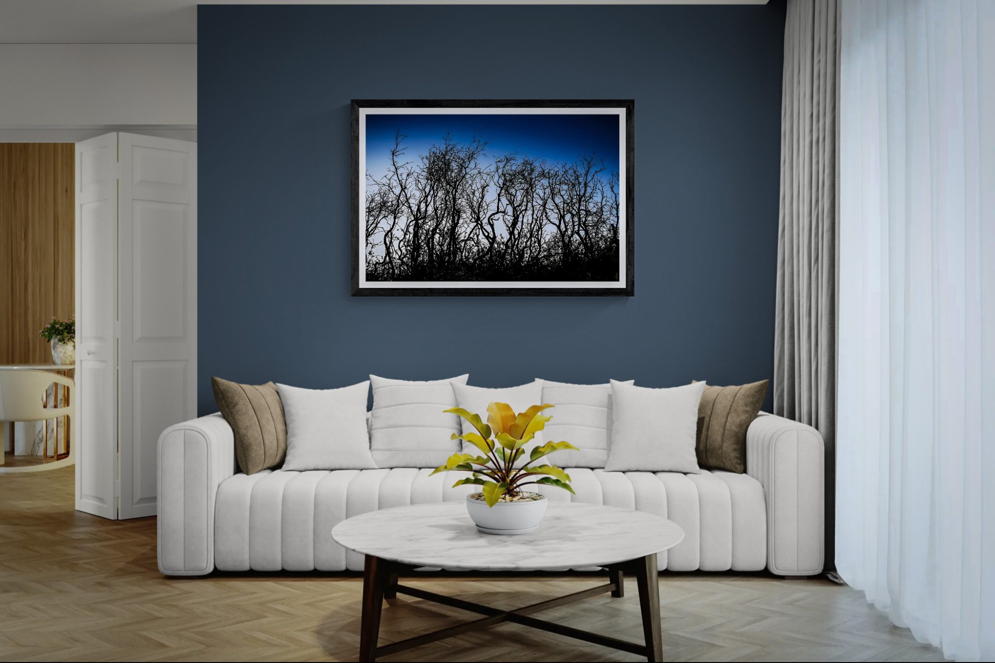 Elegant living room with framed landscape art by Doug Heslep, featuring a modern white sofa and a po.