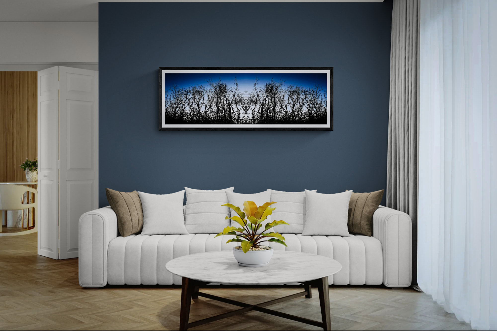 Contemporary landscape artwork featuring trees on a blue background, displayed in a stylish living r.