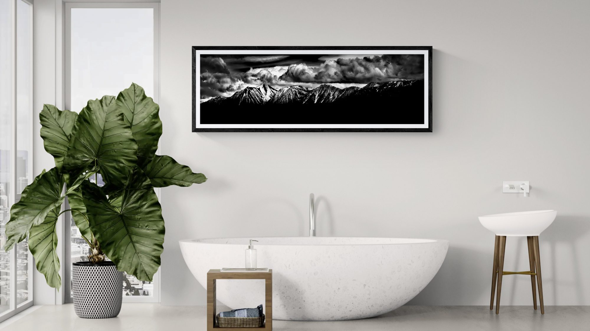 Modern bathroom with large plant and mountain artwork by Doug Heslep.