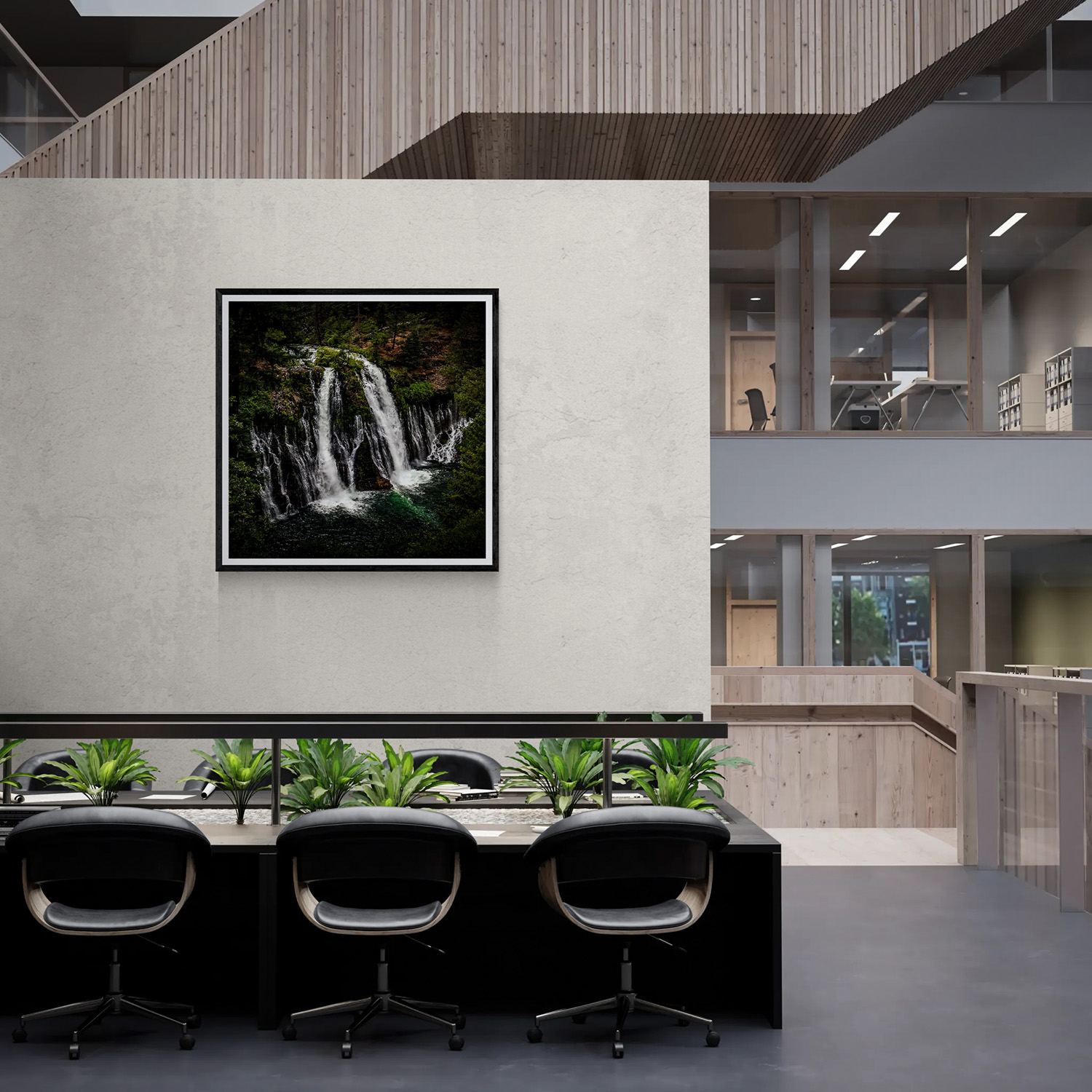 Framed waterfall landscape photography displayed on a modern office wall, part of The Doug Heslep Fine Art Collection.
