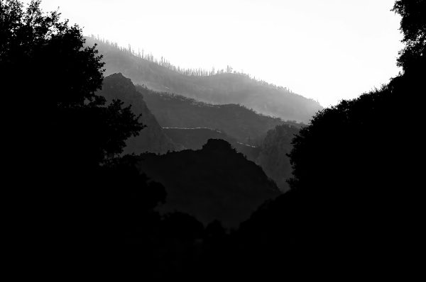 A multi-tonal cascading view in King's Canyon Nartional Park of mountain ridges reaching towards the horizon