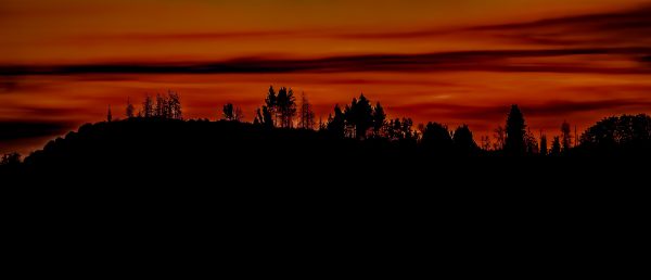 Colorful sunset while looking west across the mountain range after exiting King's Canyon