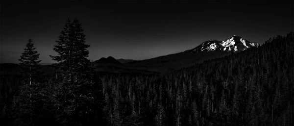 An evening view of Mount Shasta and Black Butte as seen from Castle Lake in B&W