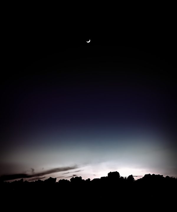 A quarter moonset over the Pacific Ocean as seen from Pacific Grove.