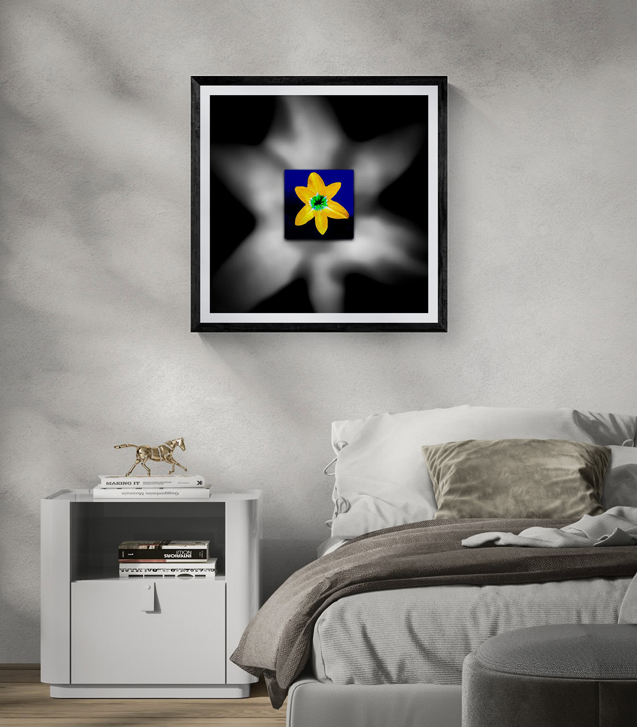 Abstract art piece with a yellow flower in a blue square on a black and white background.