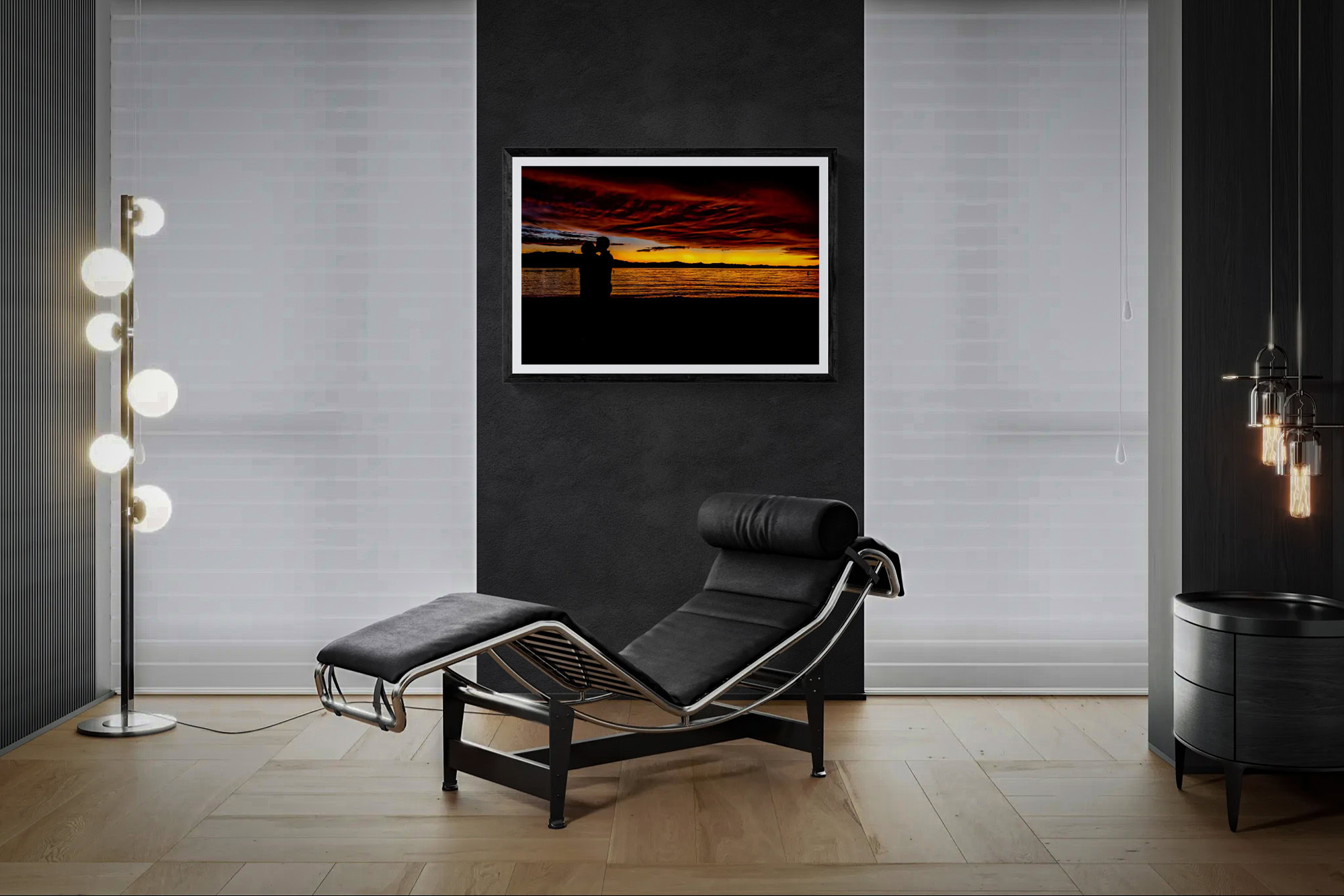 Contemporary room with sunset art and black lounge chair.