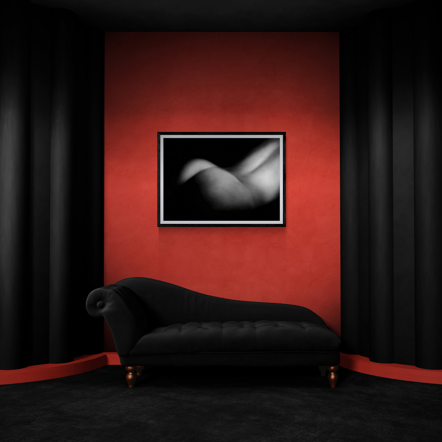 Elegant black chaise lounge in a gallery setting with a framed abstract photograph on a red wall.