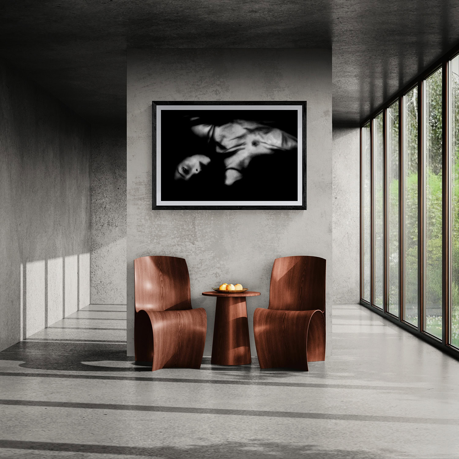 Elegant black and white nude photograph displayed in modern gallery setting.