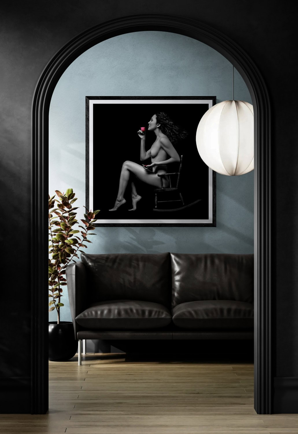 Black and white portrait of a woman with a red flower, displayed in a modern gallery setting.