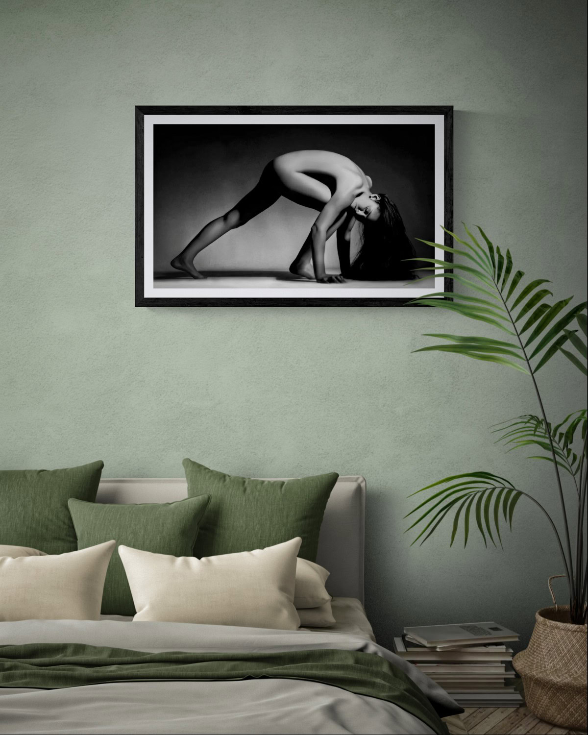 Elegant black and white nude photograph of a woman in a yoga pose.