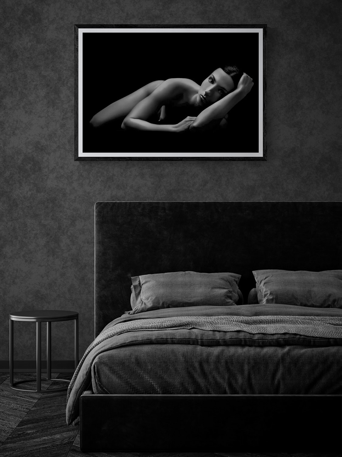 Black and white nude portrait of a woman, displayed in a contemporary bedroom setting.