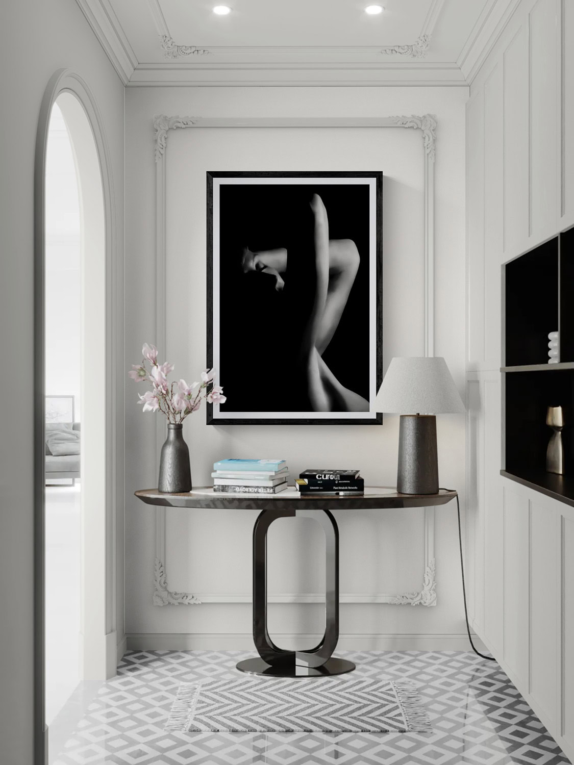 Black and white portrait of a woman with graceful pose, framed on a white wall.