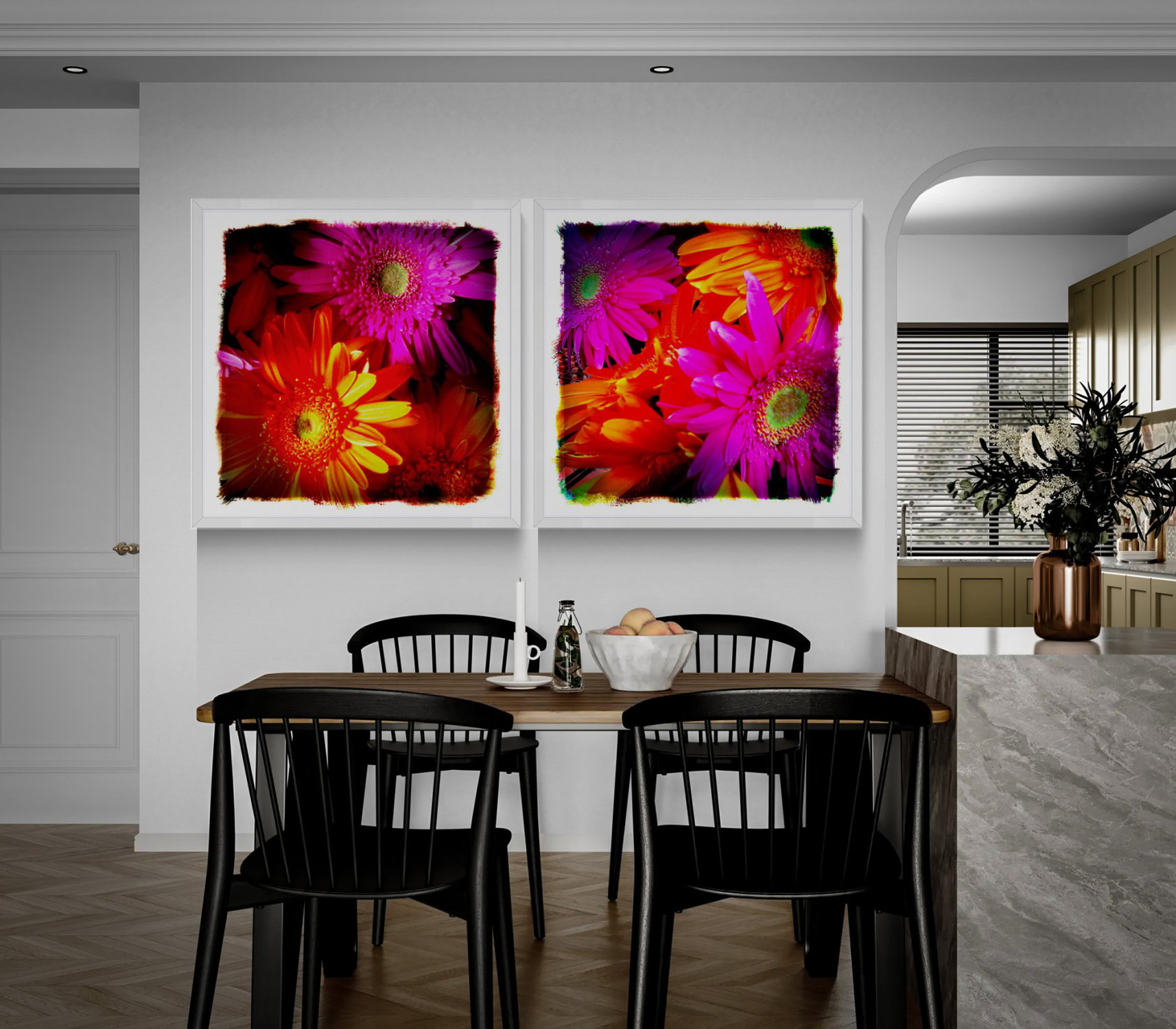 Dainty Daisies” and “Dainty Daisies Too,” colorful floral artworks in white frames, displayed side by side above a wood dining table with black chairs.