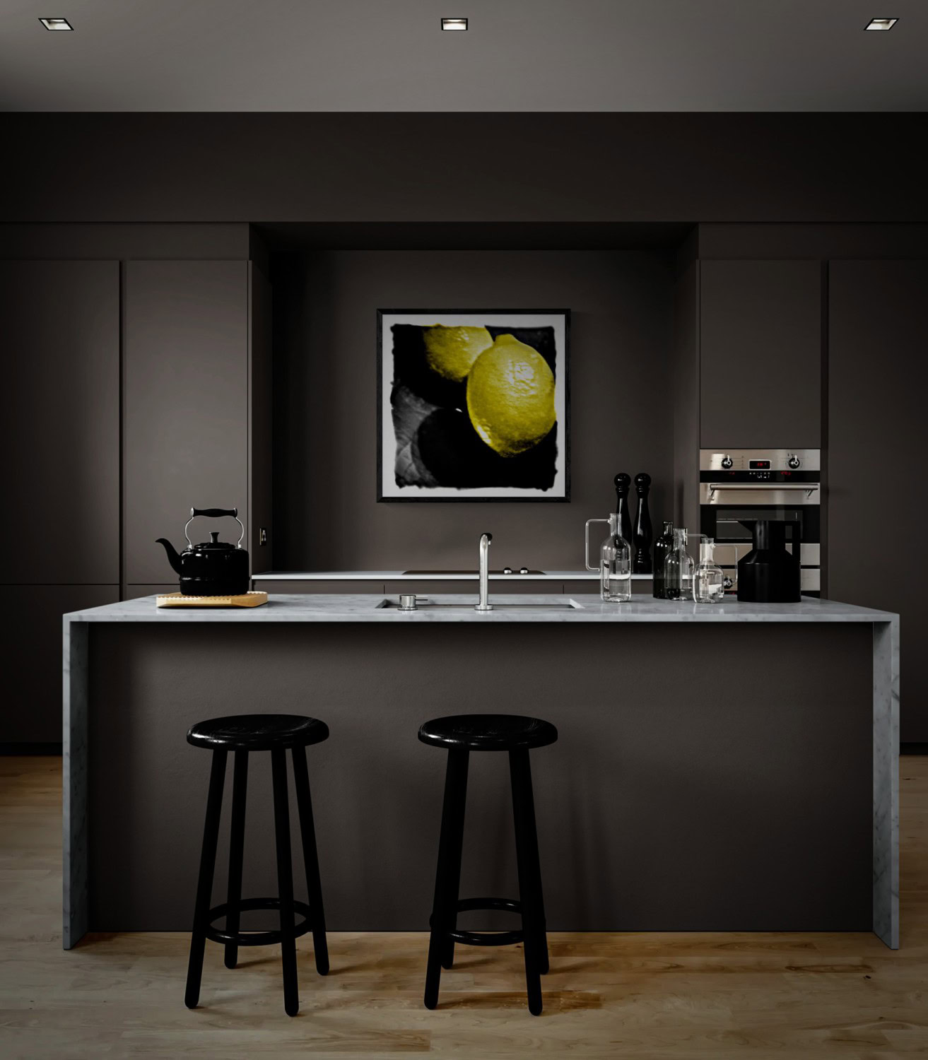 “Dos Limones,” two bright yellow lemons against a dark background, in a black frame on the wall behind an island in a charcoal kitchen.
