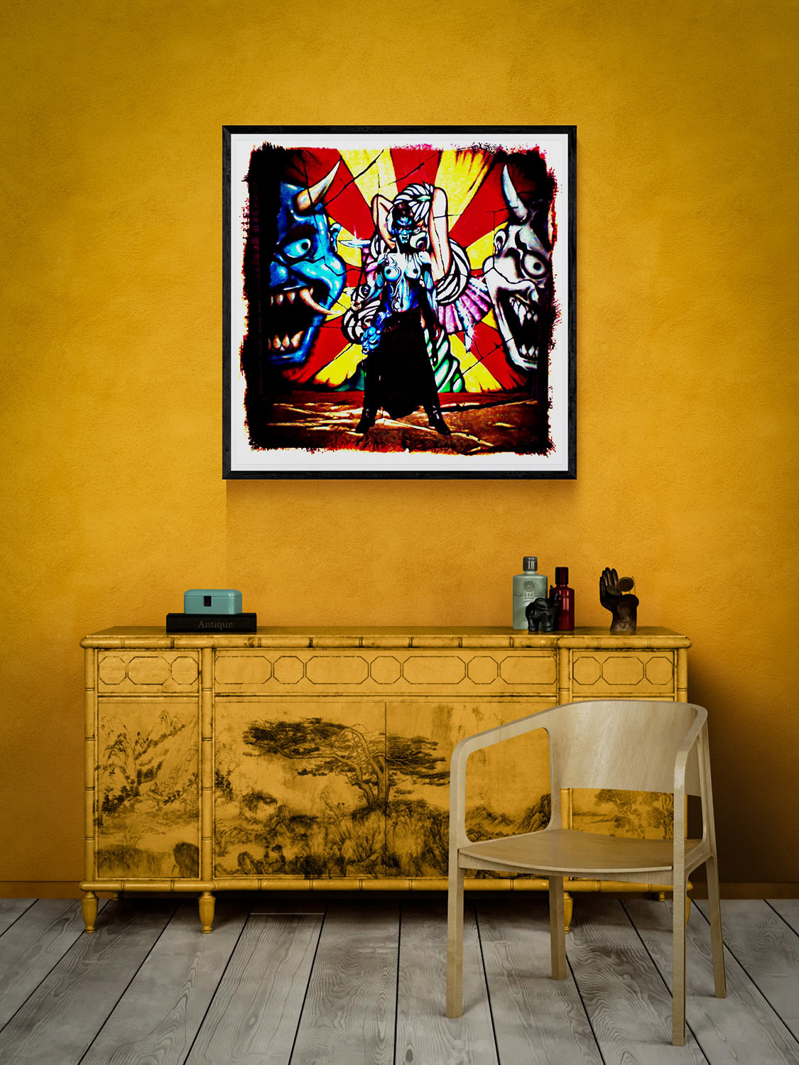 Four Eyes by Doug Heslep, displayed as framed colorful contemporary art above an Asian-inspired cabinet against a warm golden wall.