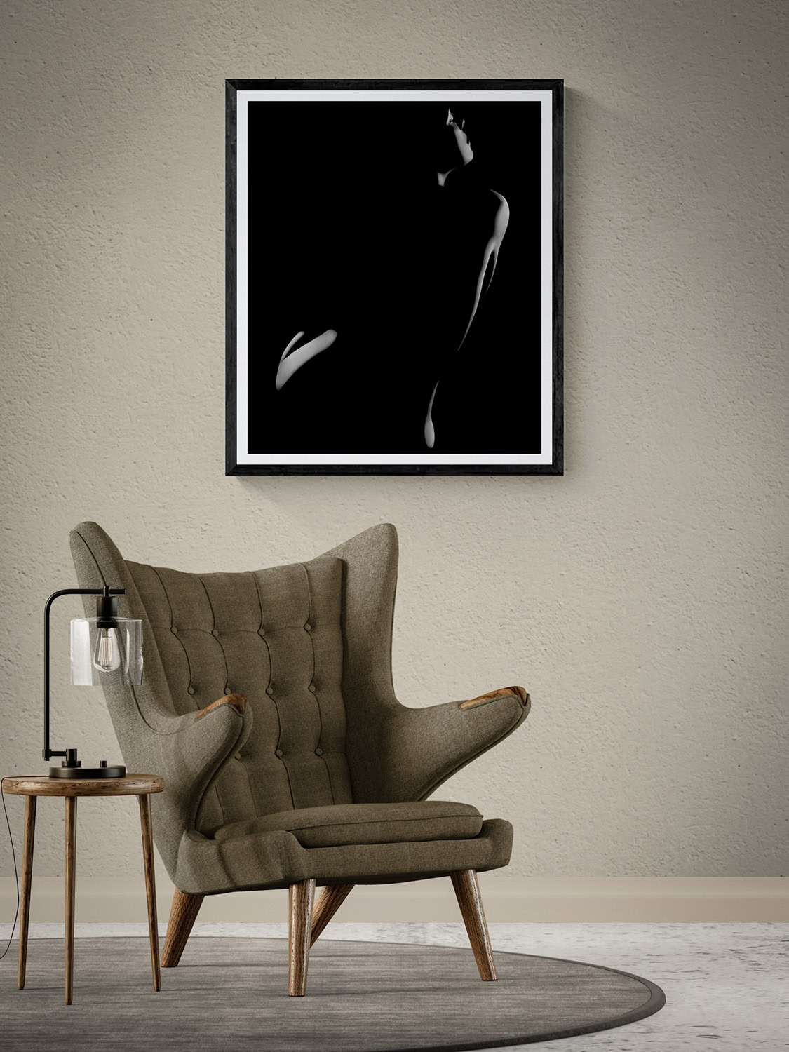 Rimlight Nude Series Plate 2 by Doug Heslep, displayed as framed black-and-white fine art above a sculptural lounge chair in a warm contemporary interior.