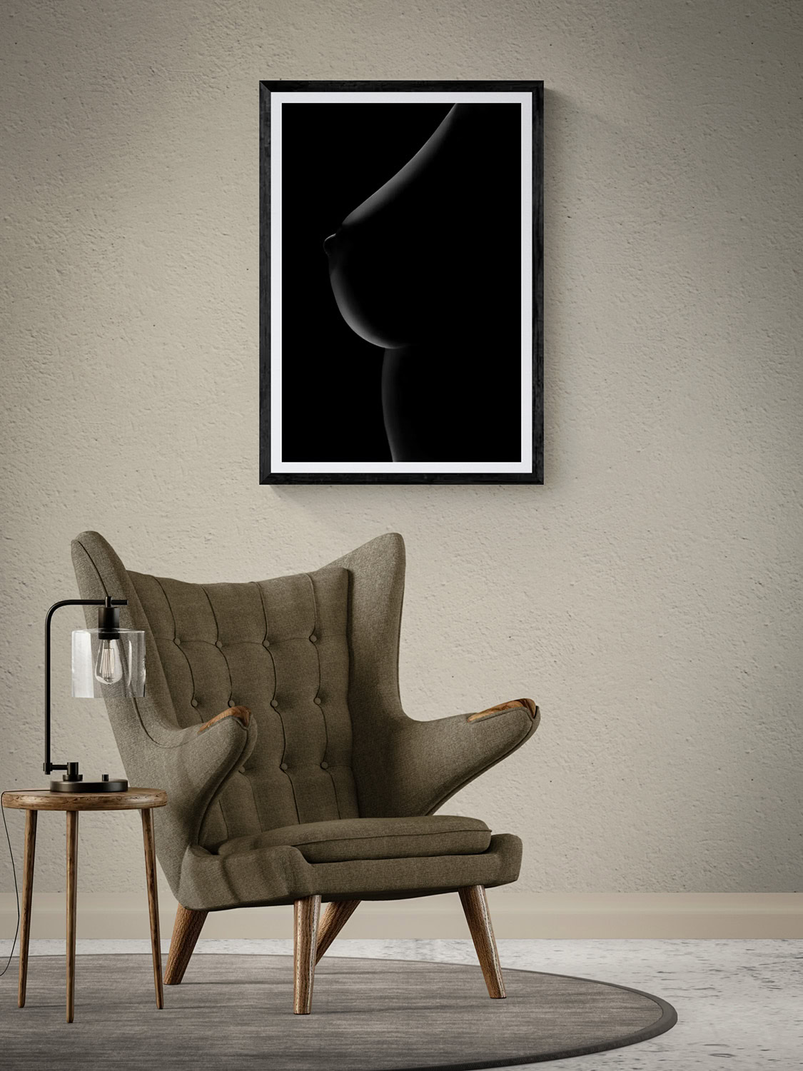 Rimlight Nude Series Plate 5 by Doug Heslep, displayed as framed black-and-white fine art above a sculptural lounge chair in a warm contemporary interior.