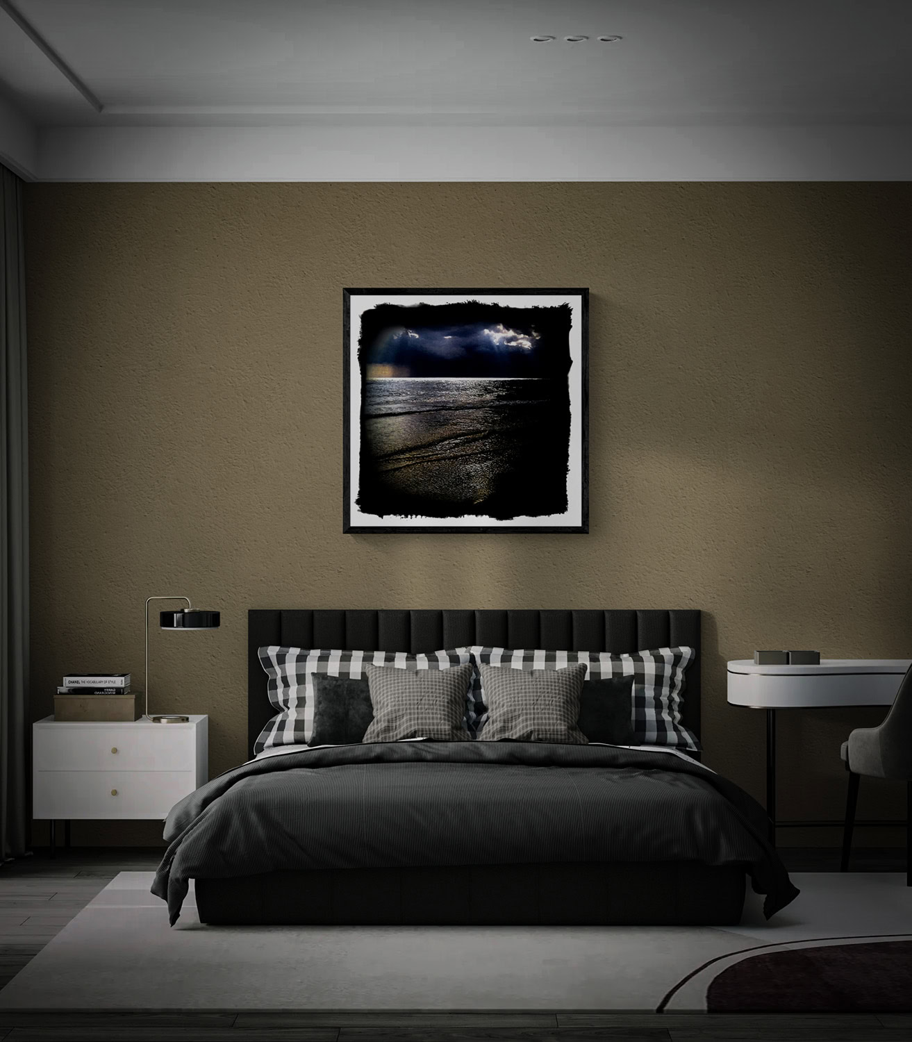 “Runaway Rainstorm,” showing dark storm clouds over a shimmering ocean and shoreline, framed above a bed against a taupe wall.